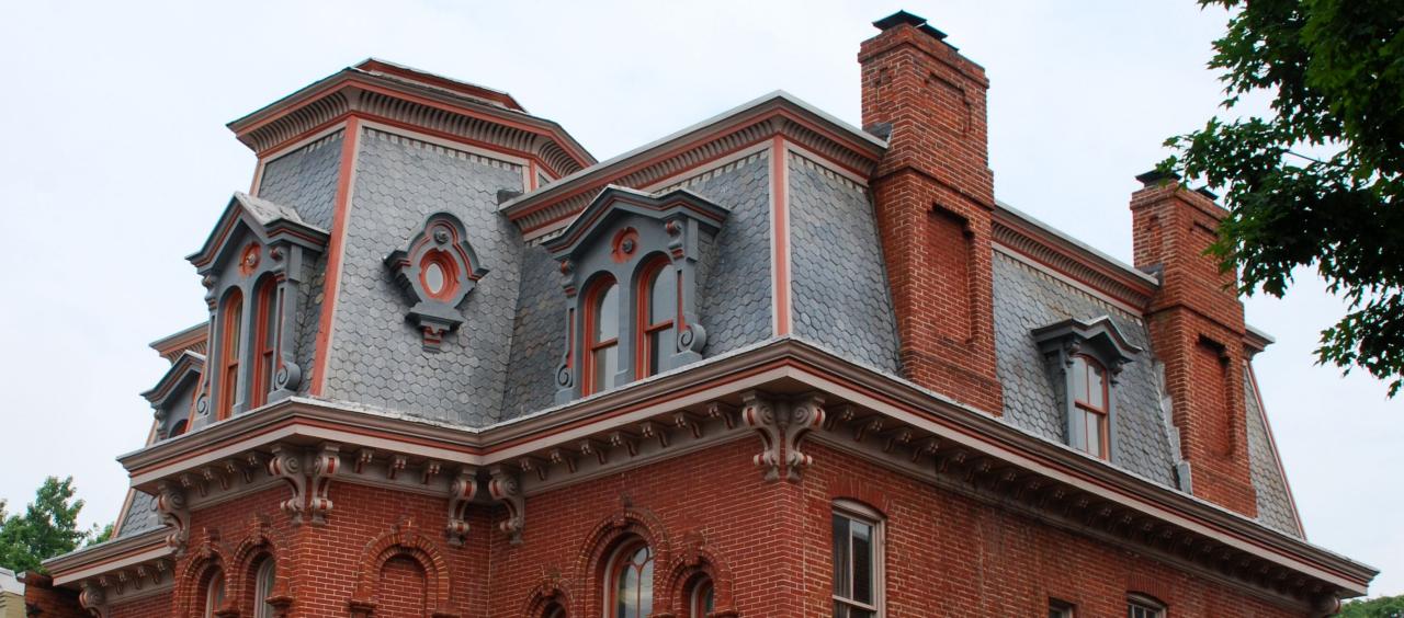 mansard roof Type of roof having two slopes on every side, the lower