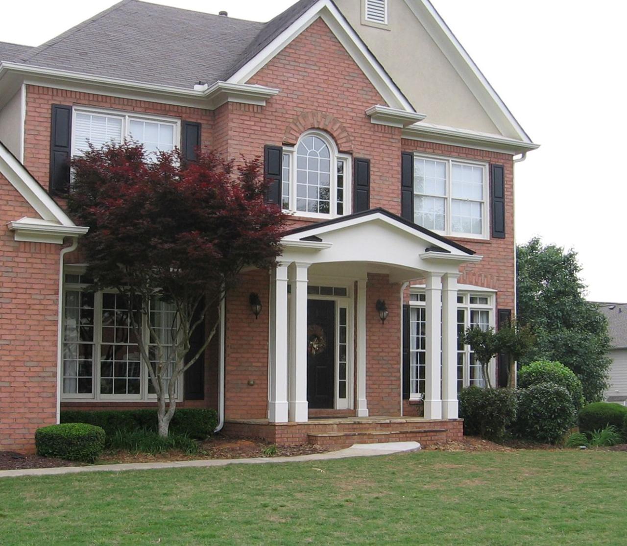Gable portico for 2 story brick home. Portico designed and built by