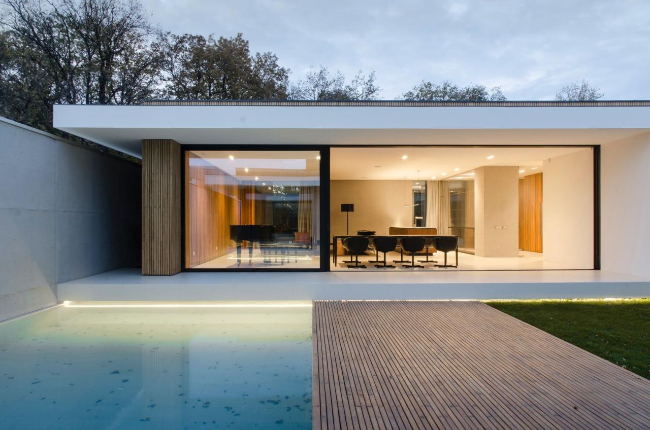 A singlestory pavilion of glass, concrete and wood, located in the