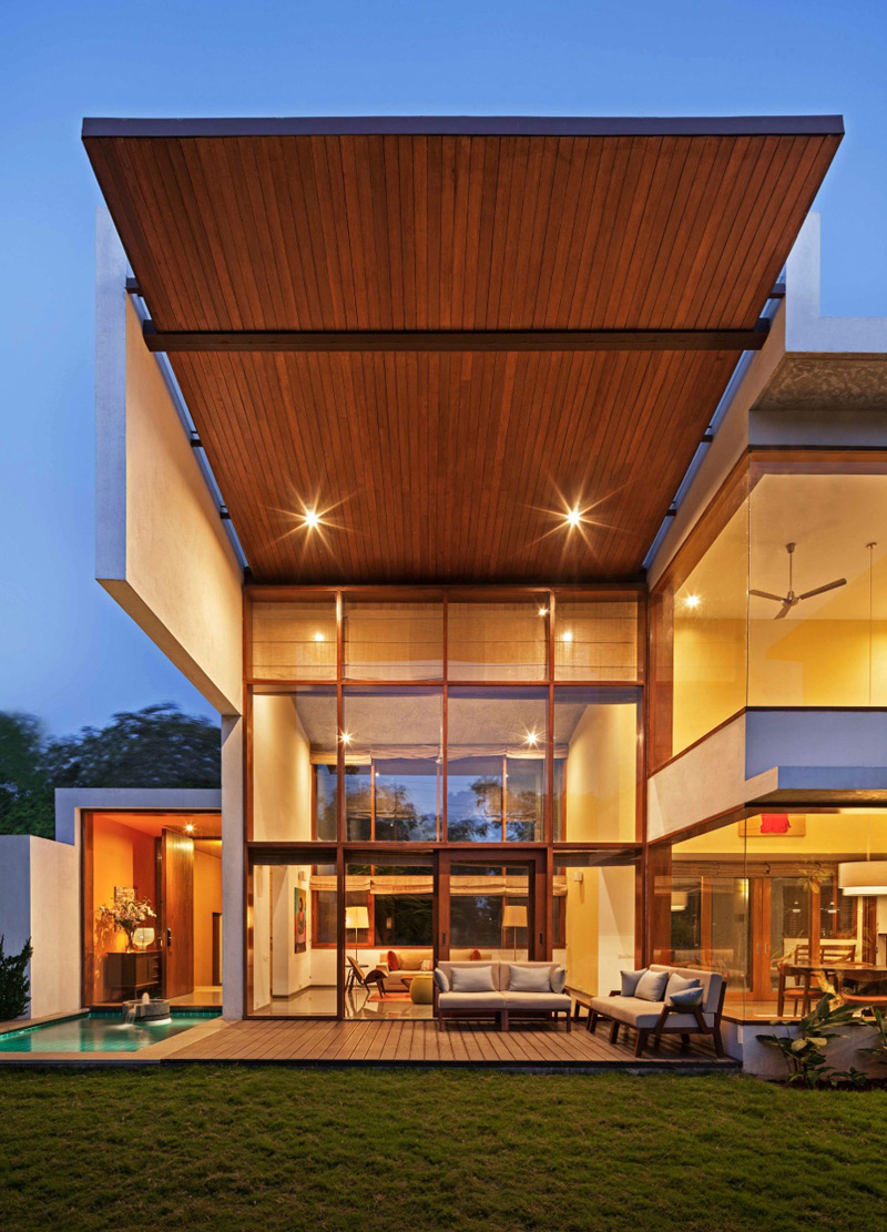 This LShaped Home's Double Height Living Room Opens To The Garden