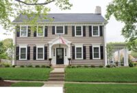 2 story colonial home featuring wood siding, decorative urethane