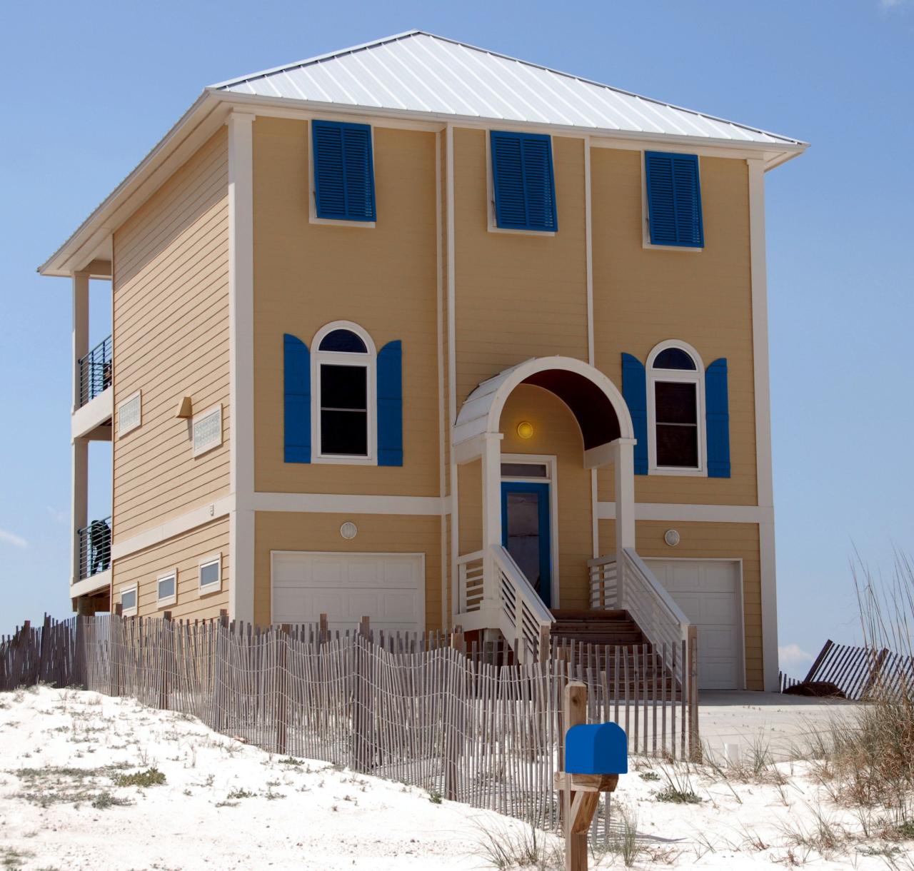 2 story beach house Featuring Front door with Full lite door glass and