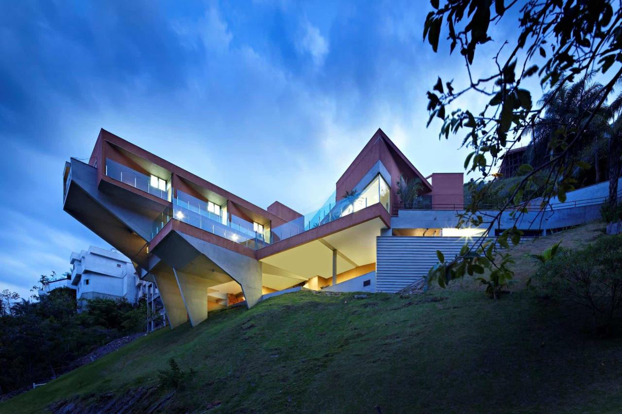Sculptural Concrete House Built on a Steep Slope Modern House Designs