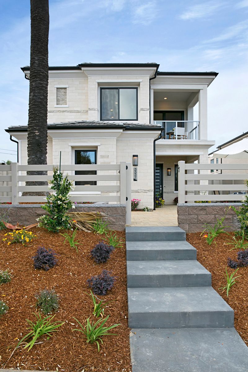 Two story miniestate with natural stone exterior and upstairs outdoor