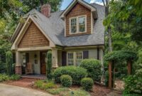 A cute 2 story cottage house designed with pitched roofing, gable