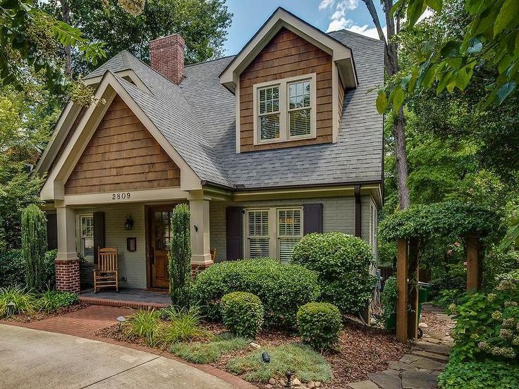 A cute 2 story cottage house designed with pitched roofing, gable