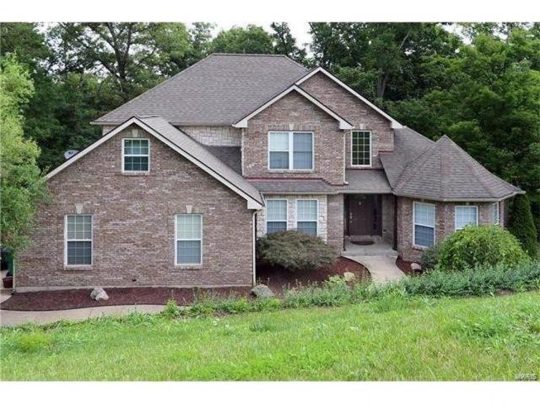 Spectacular 1.5 story home sitting on 1+ Acres in a gated community